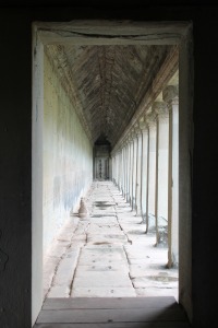 A hallway facing the mope surrounding Angkor Wat, the largest religious monument in the world. The walls are decorated with history of what had taken place many centuries ago. Every night, the women of Angkor City would dance through the hallways of the palace while King Jayavarman II had his ceremonies. Photo by Nika Chin.